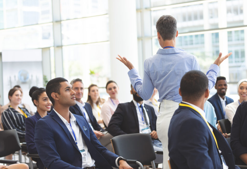 A leadership and management trainer teaching students how to sell